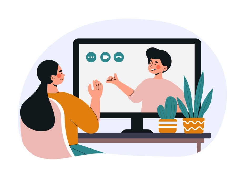 Girl sits in front of monitor screen. Video call