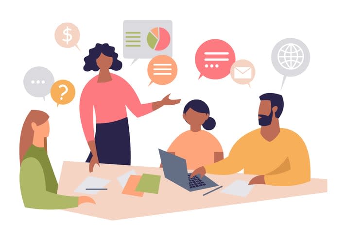 Dark-skinned female leader talking to employees in the office