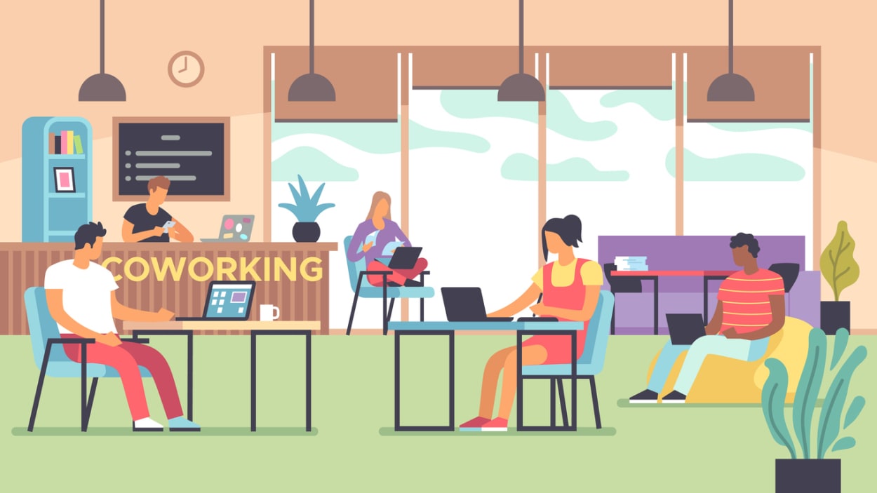Illustration of vibrant coworking space with professionals using laptops at desks and lounge areas, featuring natural light, plants, and a reception counter labeled 'COWORKING'—symbolizing modern shared workspaces.