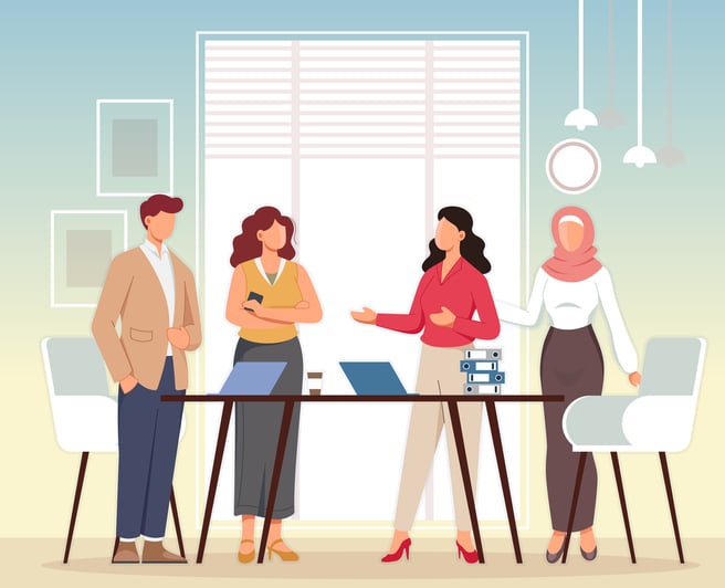 Diverse team gathered around a table in a modern office, collaborating with laptops and documents