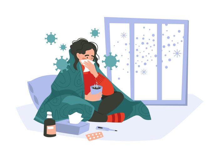 with a handkerchief and a mug of tea