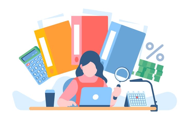 Worker studies business papers with magnifier