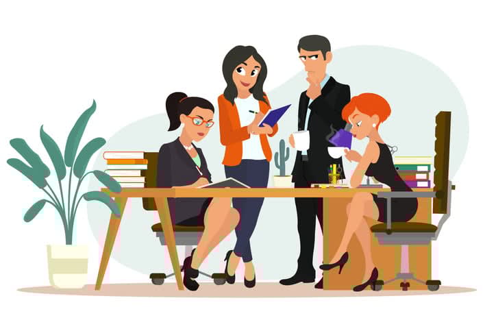 Workspace with creative people sitting at the table and working together