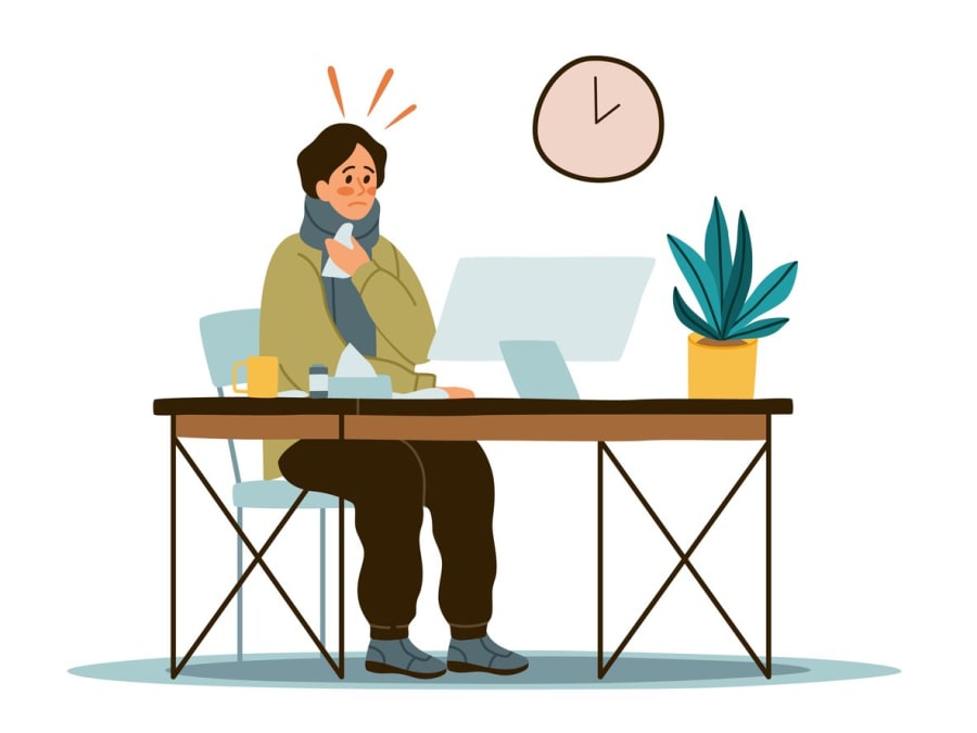 young-guy-worker-sitting-in-office-at-computer-with-high-fever-and-sick-with-cold